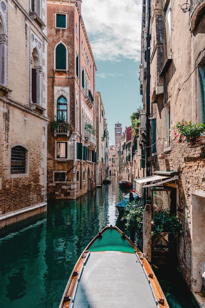 Captivating view of a traditional Venetian canal surrounded by historic buildings, perfect for travel enthusiasts.